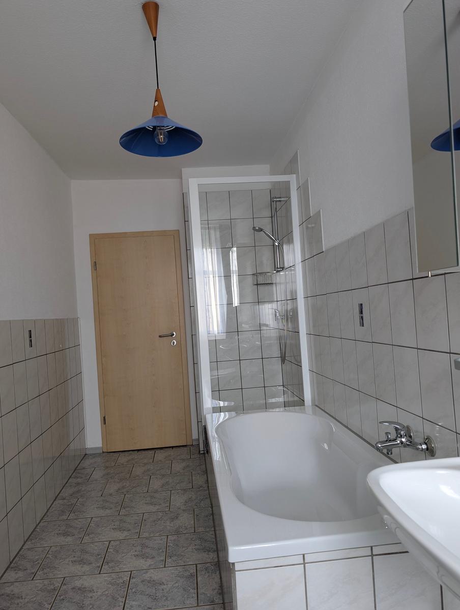 Bathroom with bathtub and shower