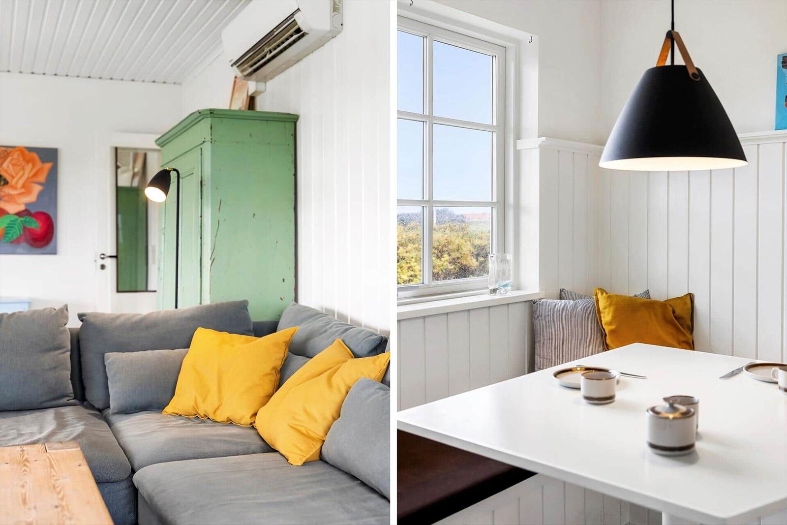 Wohnbereich mit Sofa und grünem Schrank. Essbereich mit Tisch, Fenster und Hängelampe.