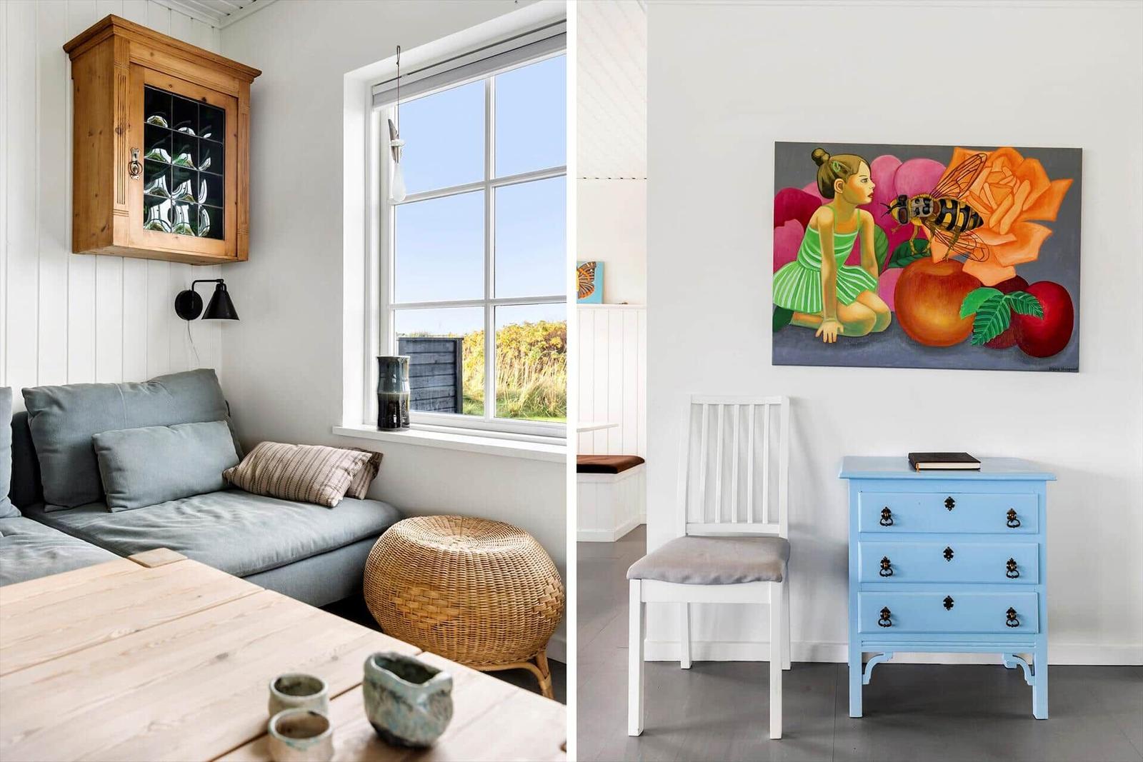 Wohnbereich mit Sofa, Fenster und Holzregal. Nebenraum mit Stuhl, Schrank und Wandbild.
