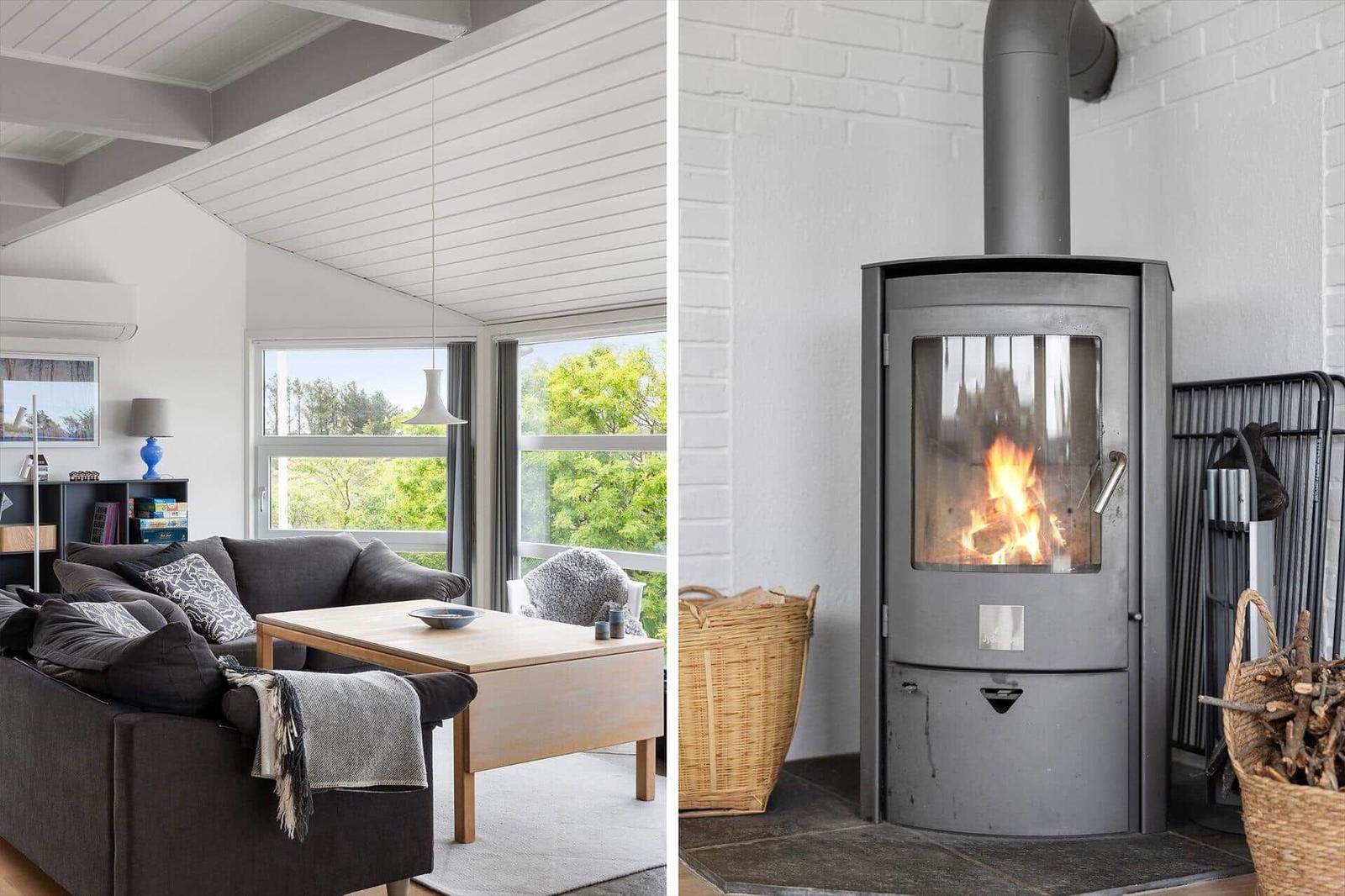 Living room with sofa and table. Wood-burning stove.