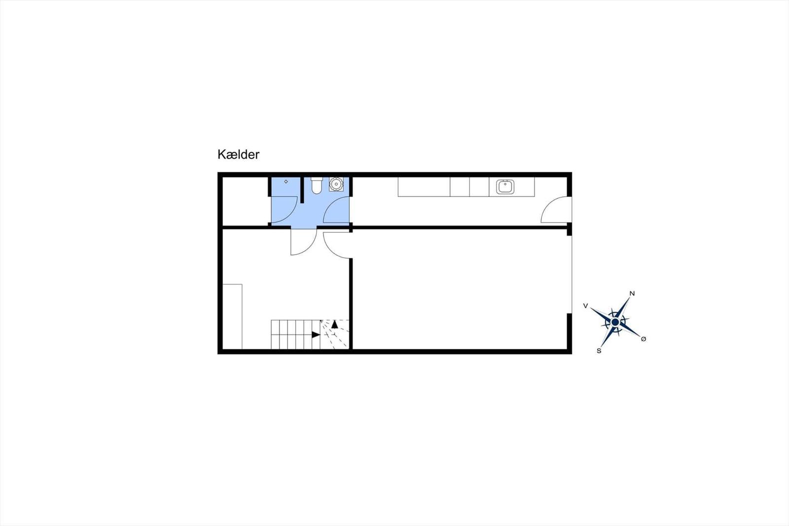 Basement with bathroom, kitchen, and staircase. Compass shows orientation.
