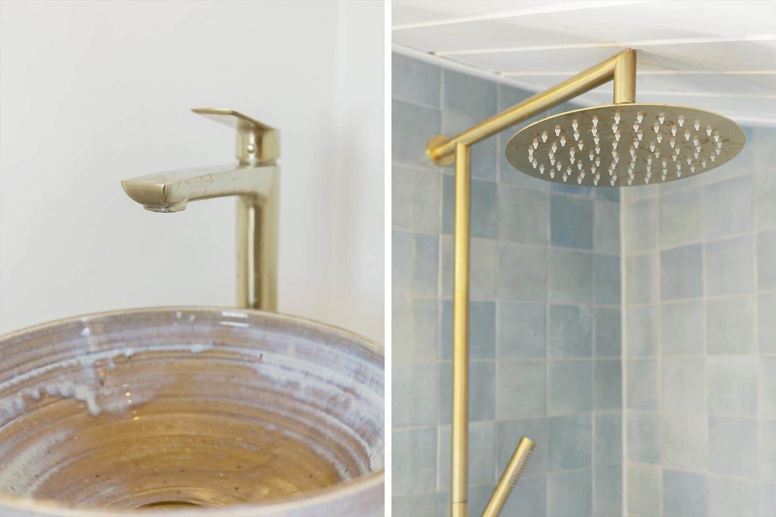 Gold faucet over ceramic sink and shower head in tiled bathroom
