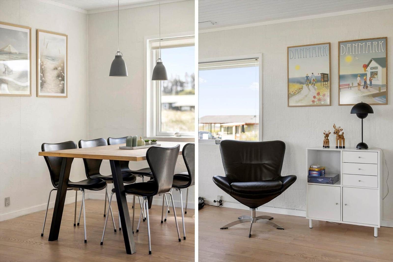 Dining room with table and chairs. Adjacent room with armchair and cabinet. Wall art with Denmark motifs.