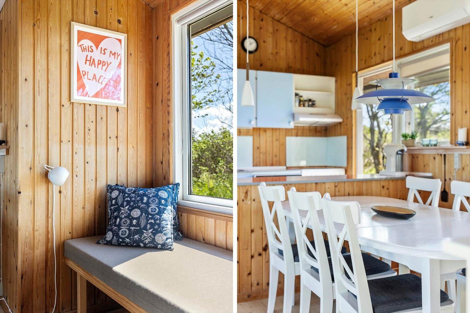 Living area with bench and window. Kitchen area with table and chairs.