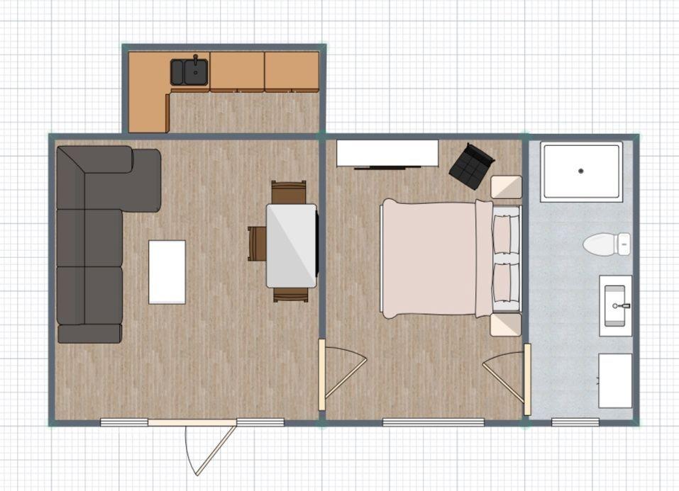 Wohnung mit Küche, Wohn- und Schlafbereich sowie Bad.