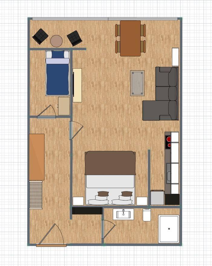 Dieses Apartment hat zwei Schlafzimmer, eine Küche, ein Bad und einen Wohnbereich mit Esstisch.