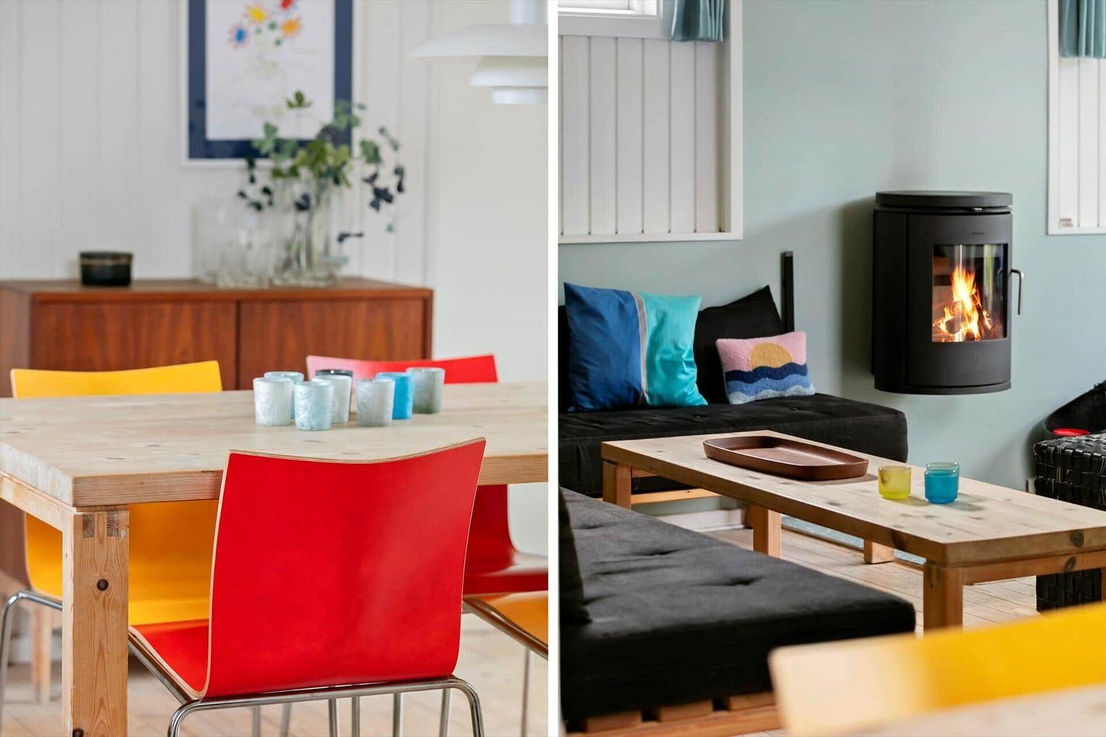Dining area with wooden table and colorful chairs. Living area with sofa, fireplace, and wooden bench.