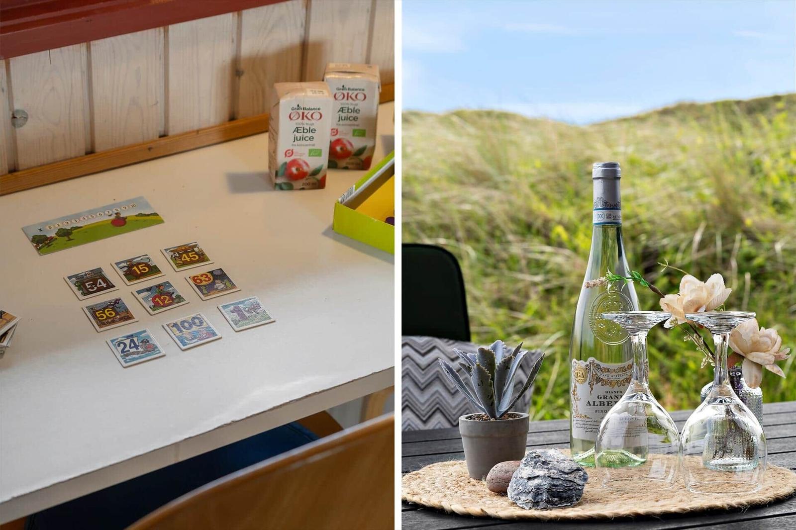 Tisch mit Spielkarten und Apfelsaft. Außentisch mit Wein, Gläsern und Pflanze.