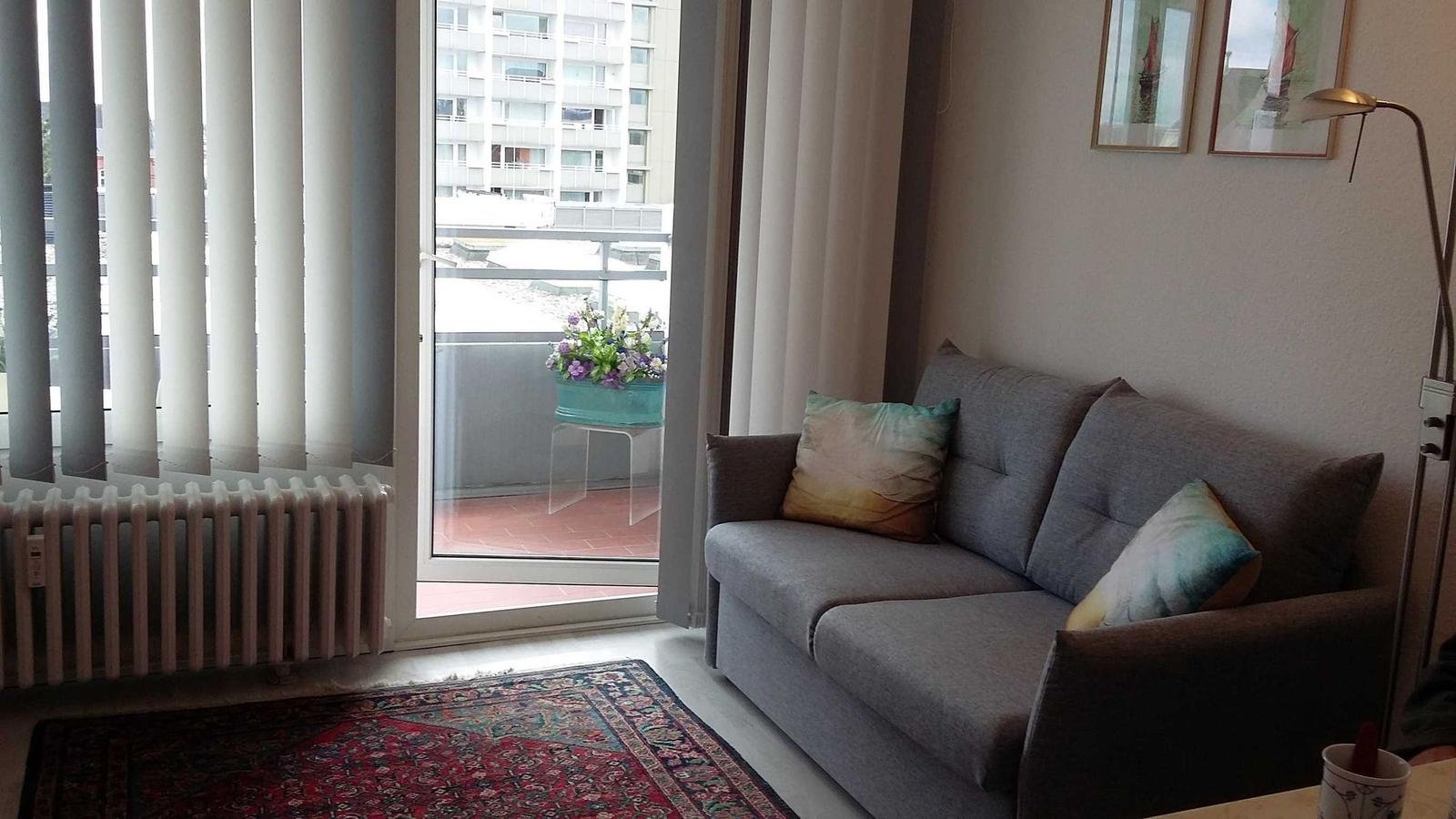 Cozy Living Room with Balcony Access