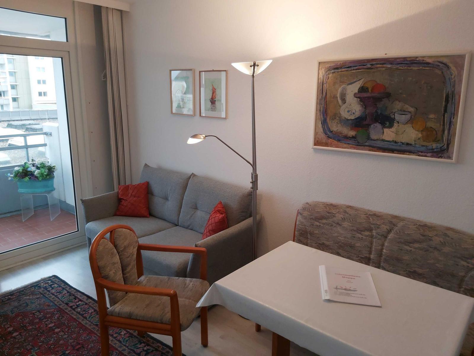 Cozy Living Room with Sofa and Dining Table