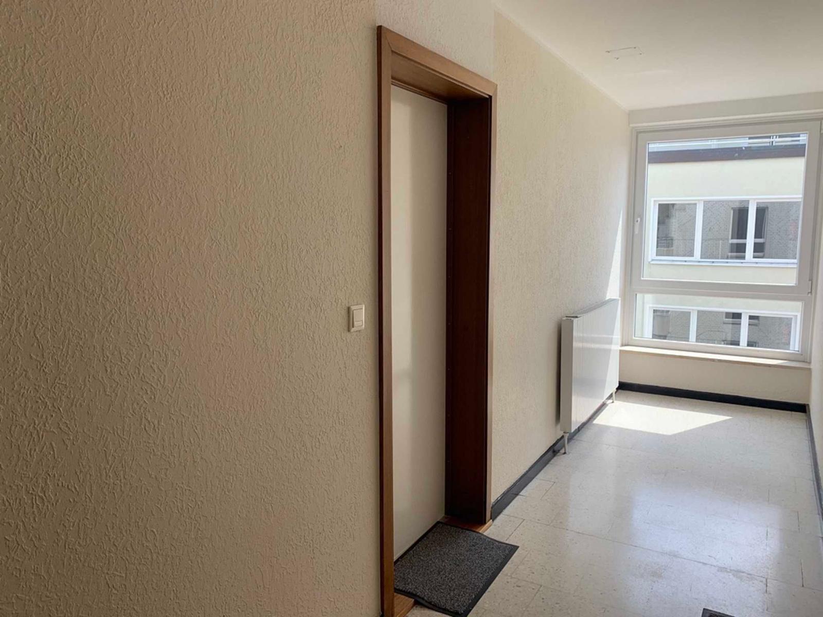 Bright Hallway with Window and Door