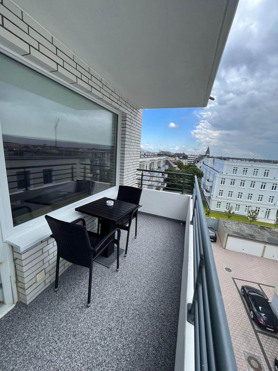 Balcony with table and chairs