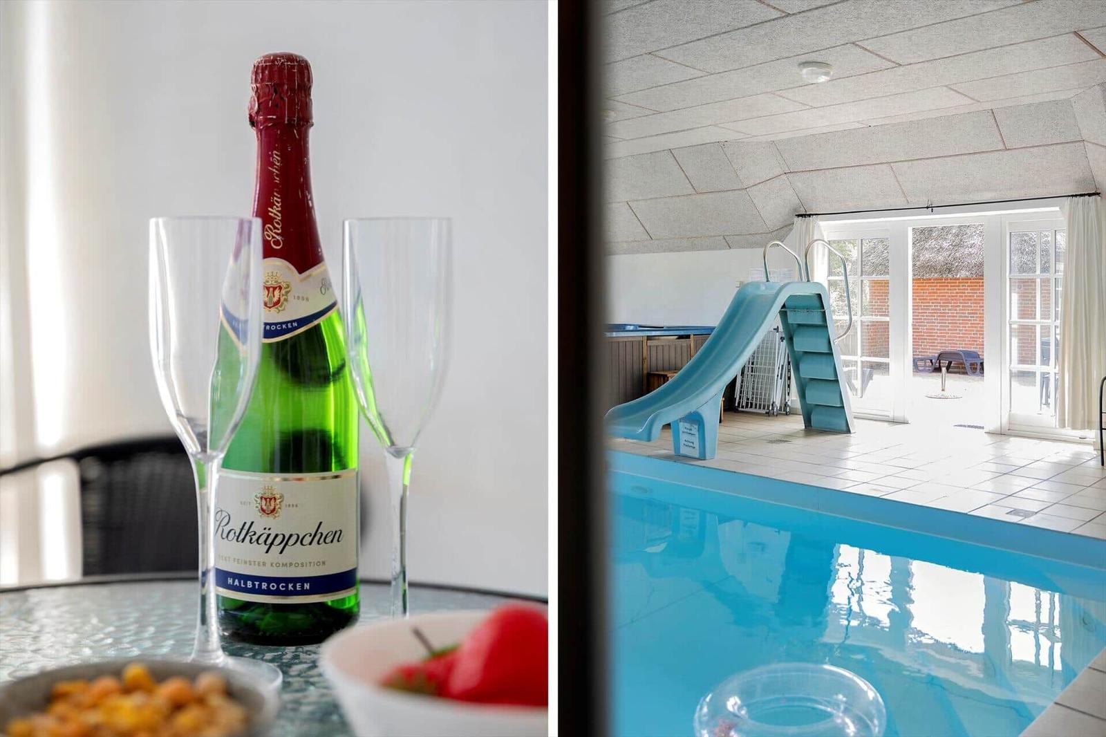 Sekt und Obst auf Tisch. Indoor-Pool mit Rutsche und Terrasse.