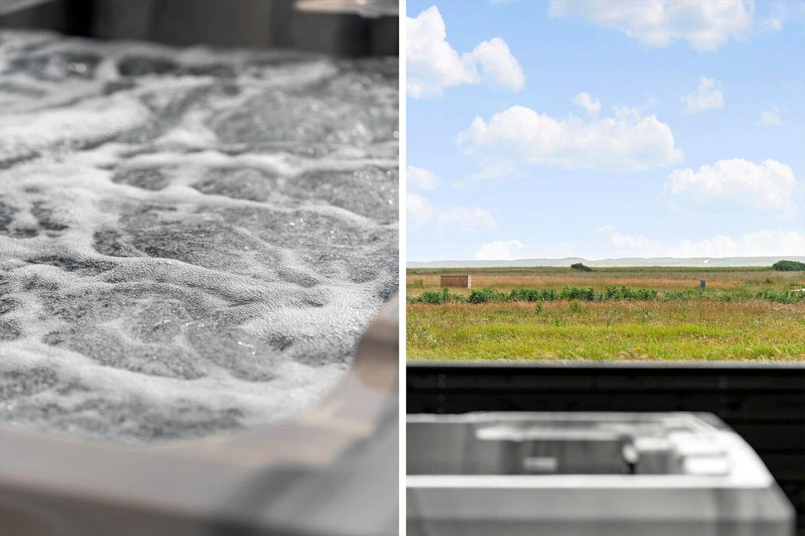 Badewanne mit Schaum und Blick auf Feld und Himmel