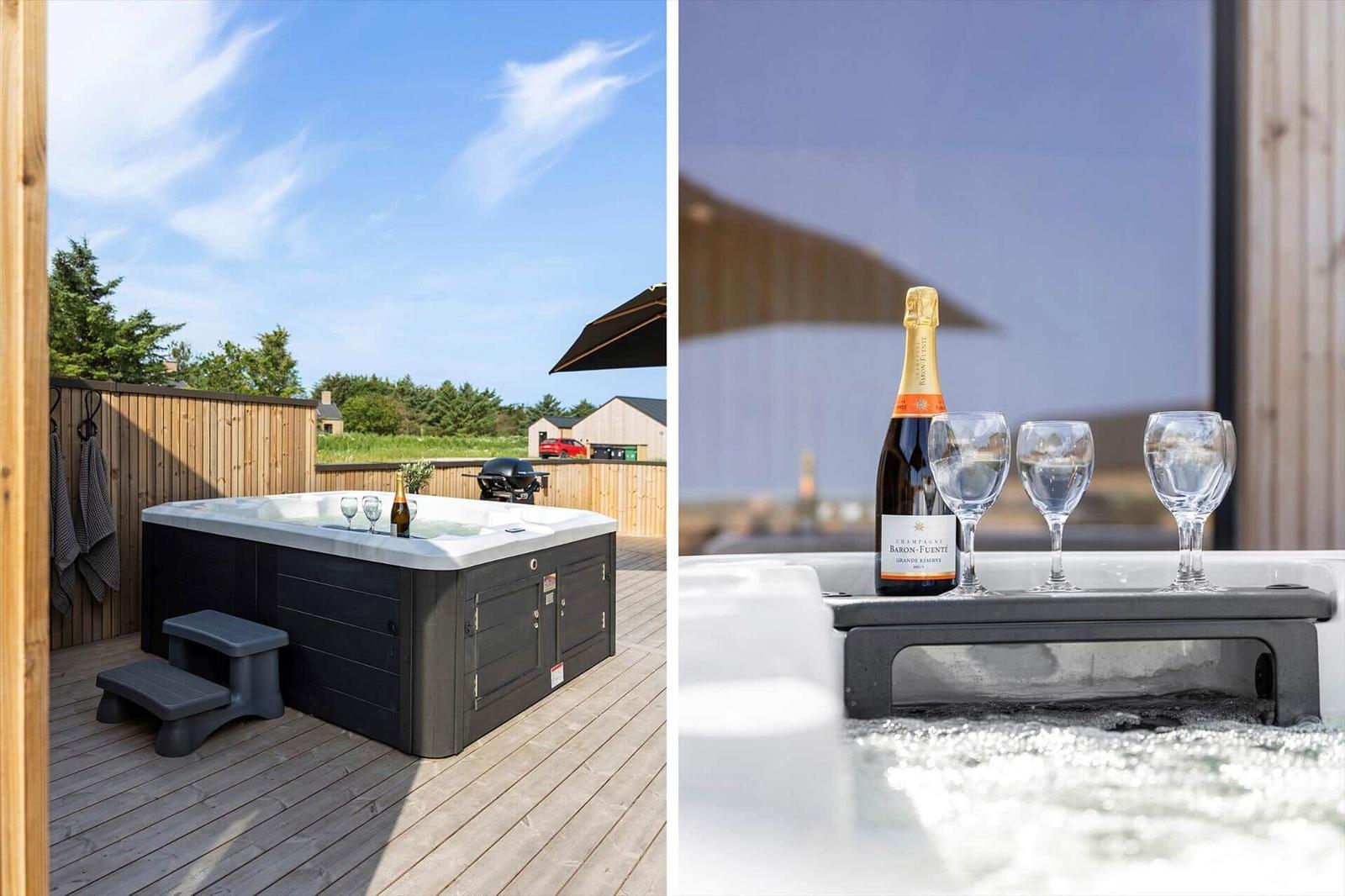 Hochwertige Whirlpoolanlage mit Champagner und Gläsern auf der Terrasse.