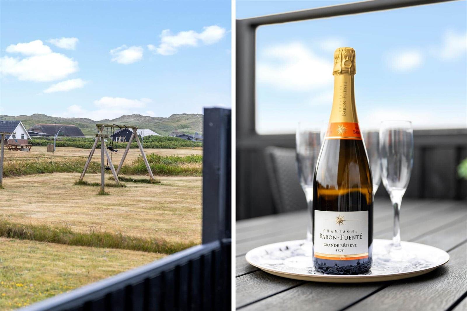 Außenbereich mit Schaukel und Blick auf Felder. Flasche Champagner und Gläser auf Tisch.