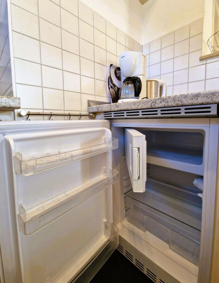 Kitchen with refrigerator, coffee maker, and work surface