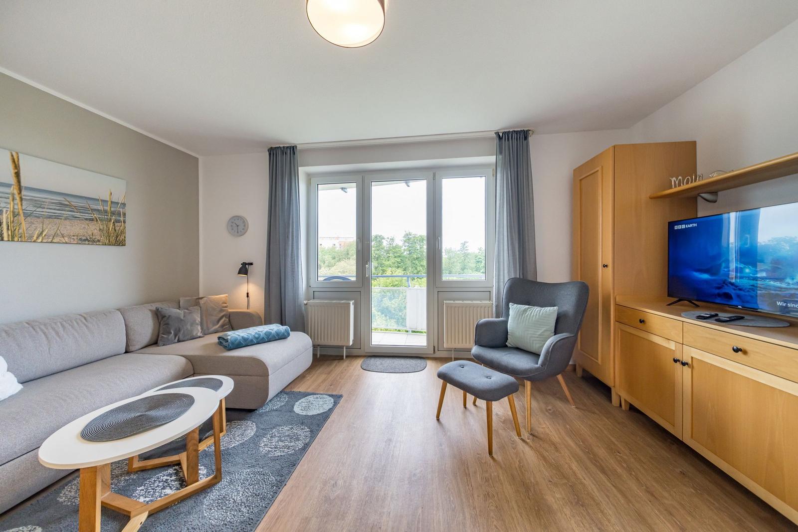 Wohn-Essbereich mit Couch im sihi220, Hus Inselkieker, Mellumweg 6b in Schillig