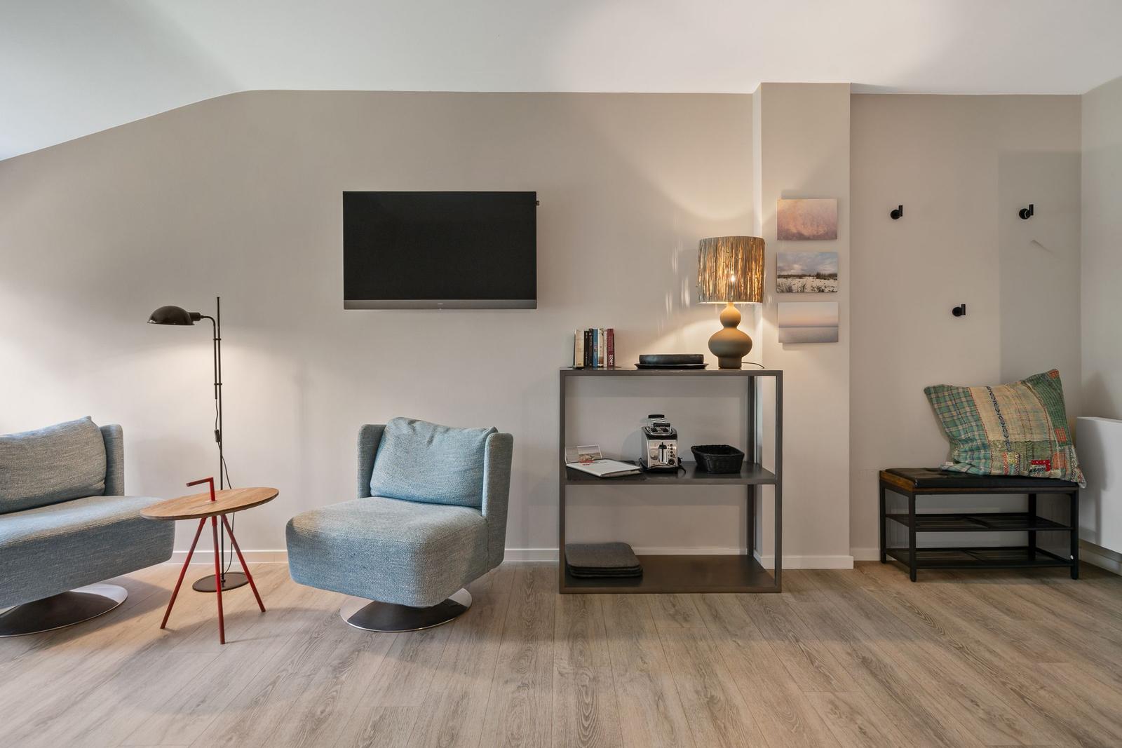 Living room with seating, TV, and side table
