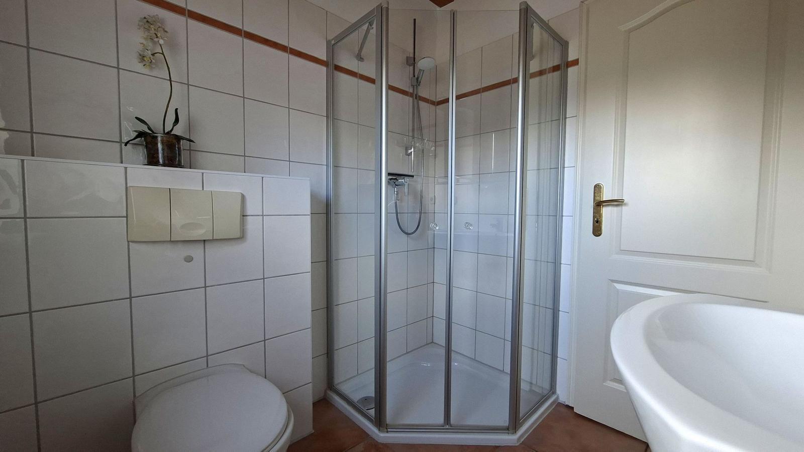 Bathroom with shower, toilet, and bathtub.