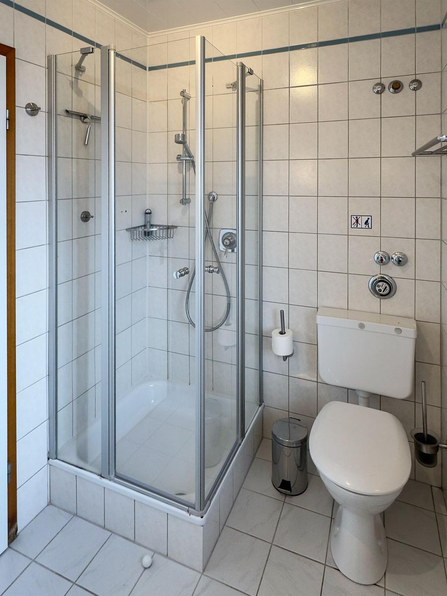 Bathroom with shower, toilet and sink