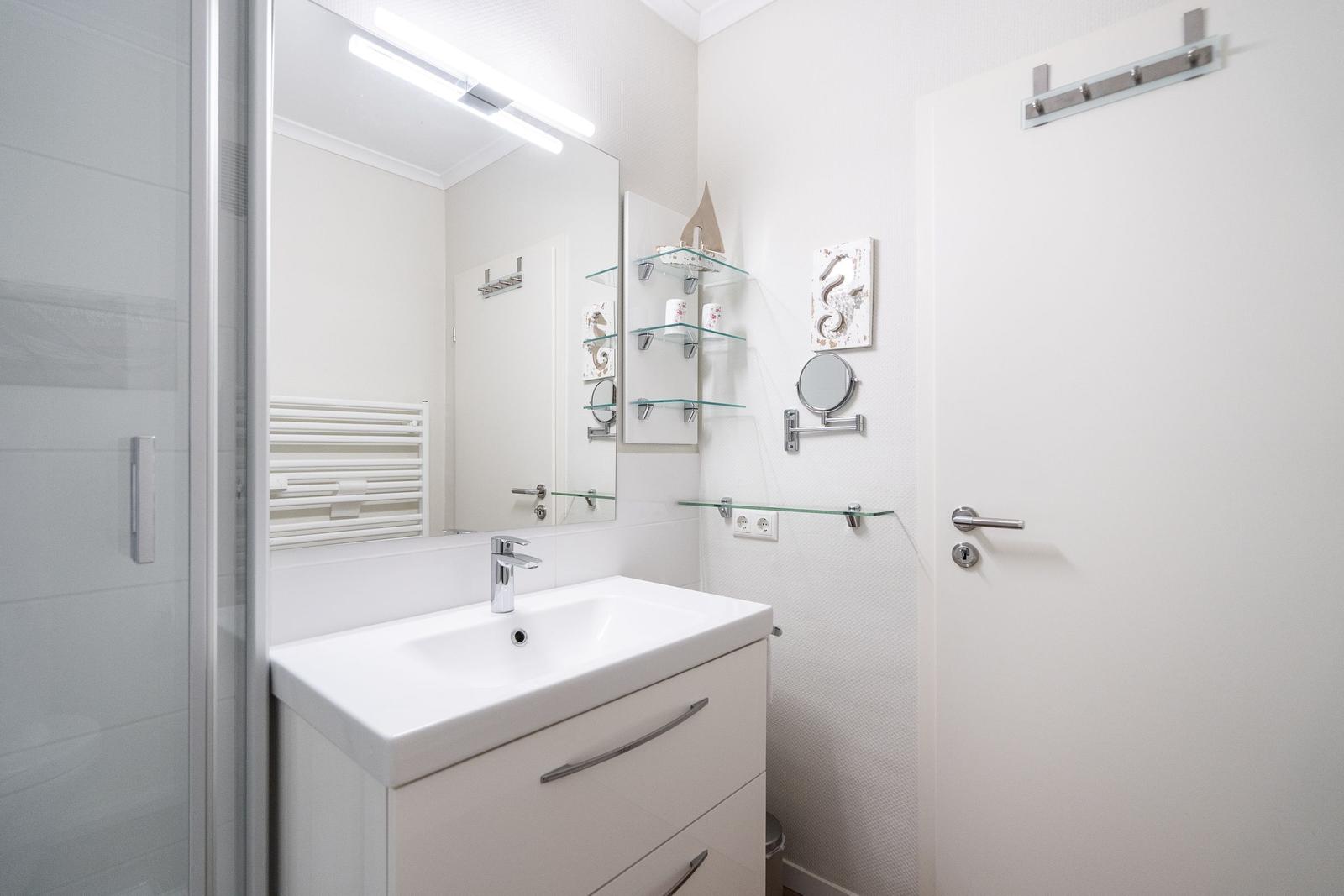 Bathroom with sink, mirror, and shower
