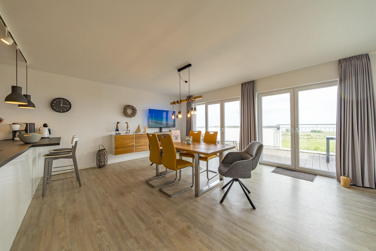 Wohn-Essbereich mit Flatscreen-TV im sinf48-6-N, Nordsee-Resort Friesland, Mellumweg 1 in Schillig