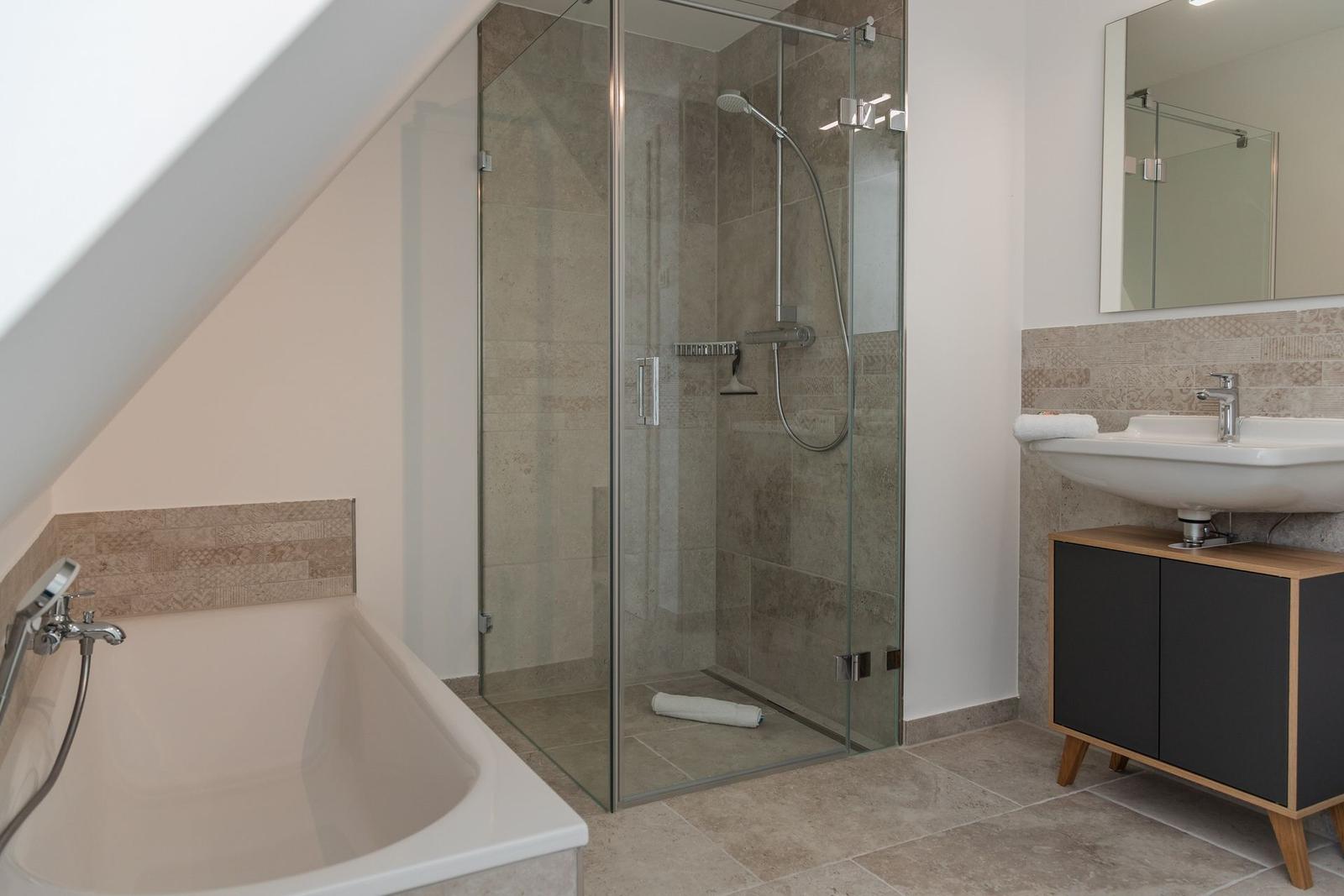Bathroom with shower, bathtub, and sink
