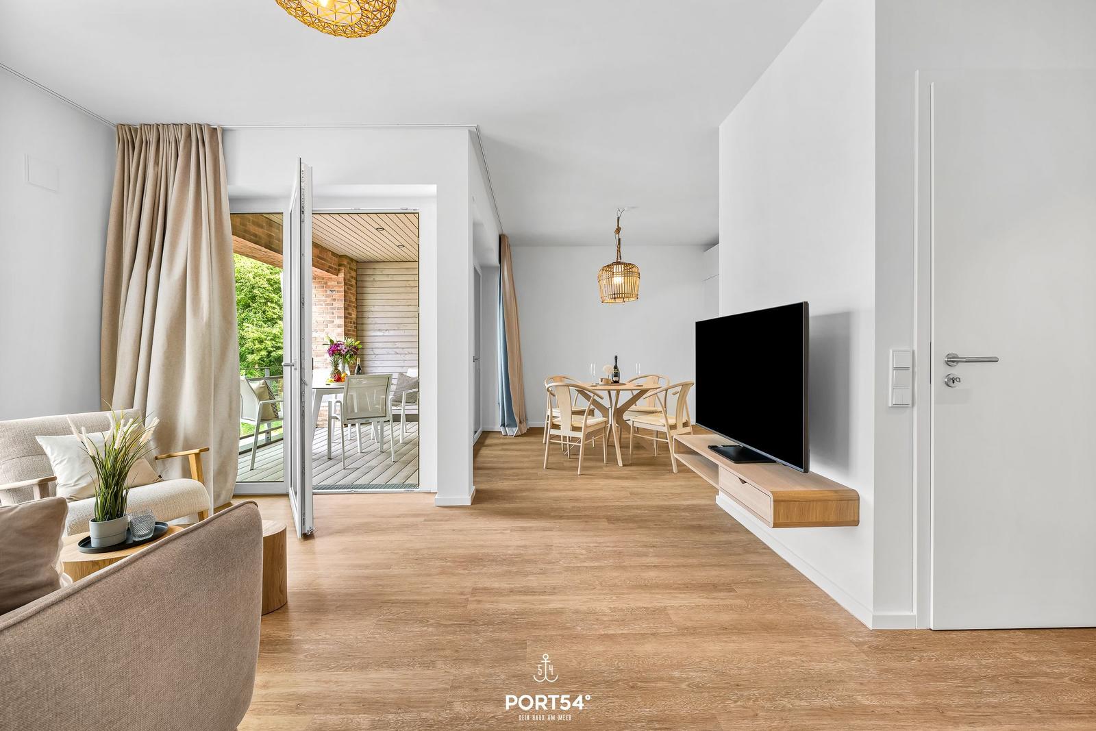Living and dining area with TV, terrace and wooden floor