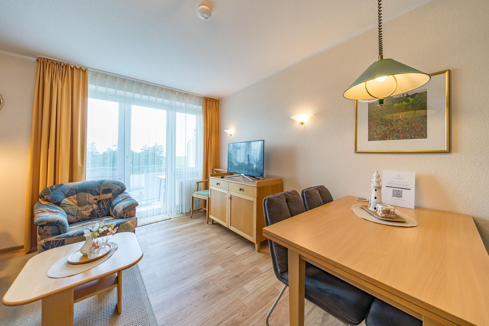 Wohn-Essbereich mit Flatscreen-TV im sihi217, Hus Inselkieker, Mellumweg 6b in Schillig