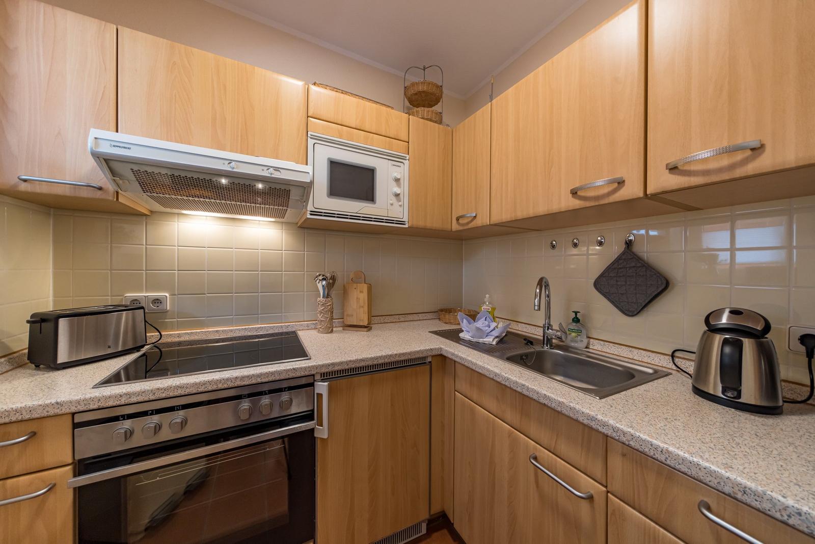 Küchenzeile mit Backofen im sihi217, Hus Inselkieker, Mellumweg 6b in Schillig