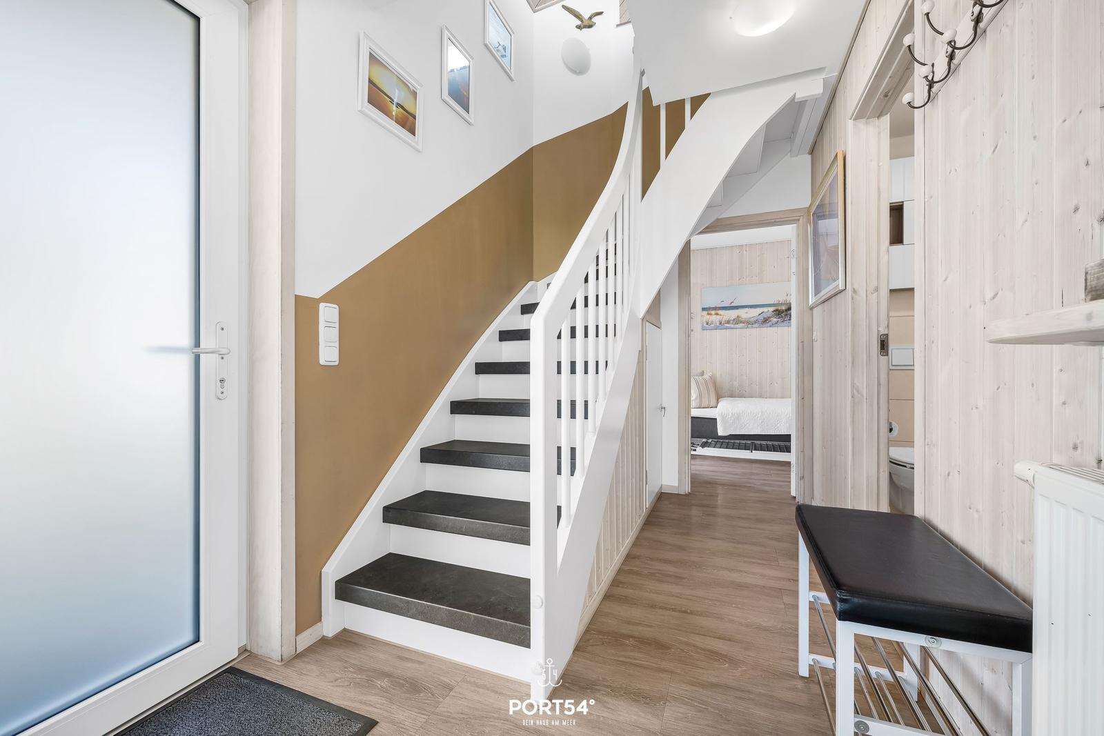 House with staircase, entrance area, and view into bedroom