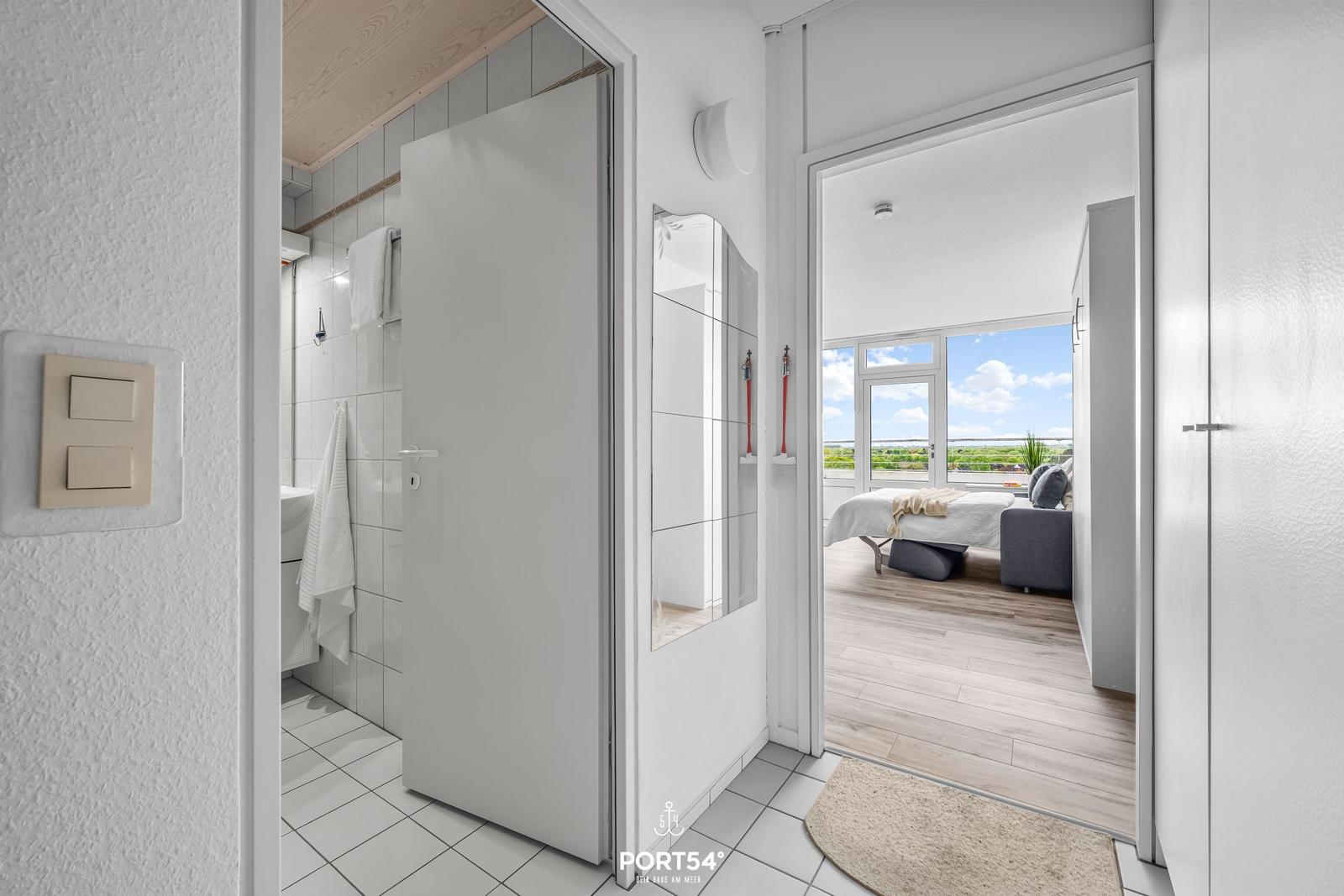 Bathroom and bedroom with view of the landscape.
