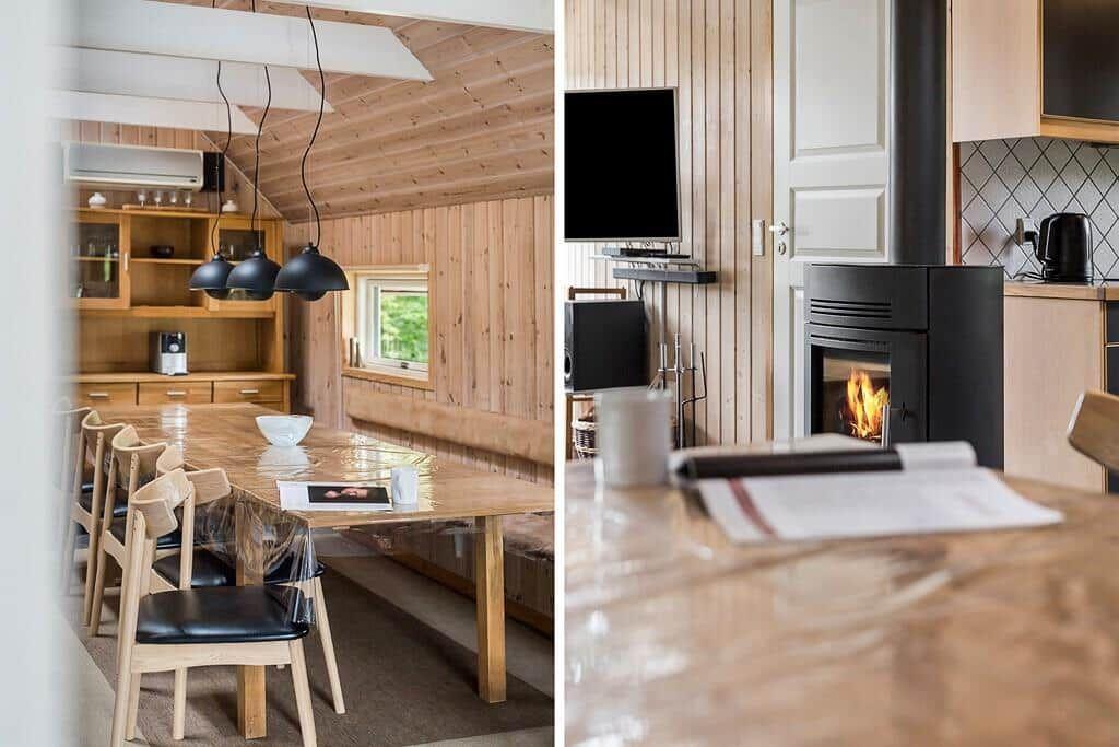 Essbereich mit Holztisch und -stühlen, Kamin und TV im Wohnbereich.