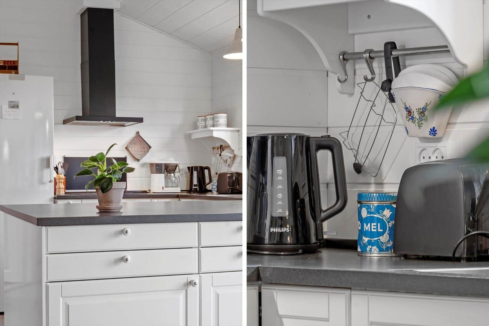 Kitchen with white cabinets, gray countertop, and kitchen appliances.