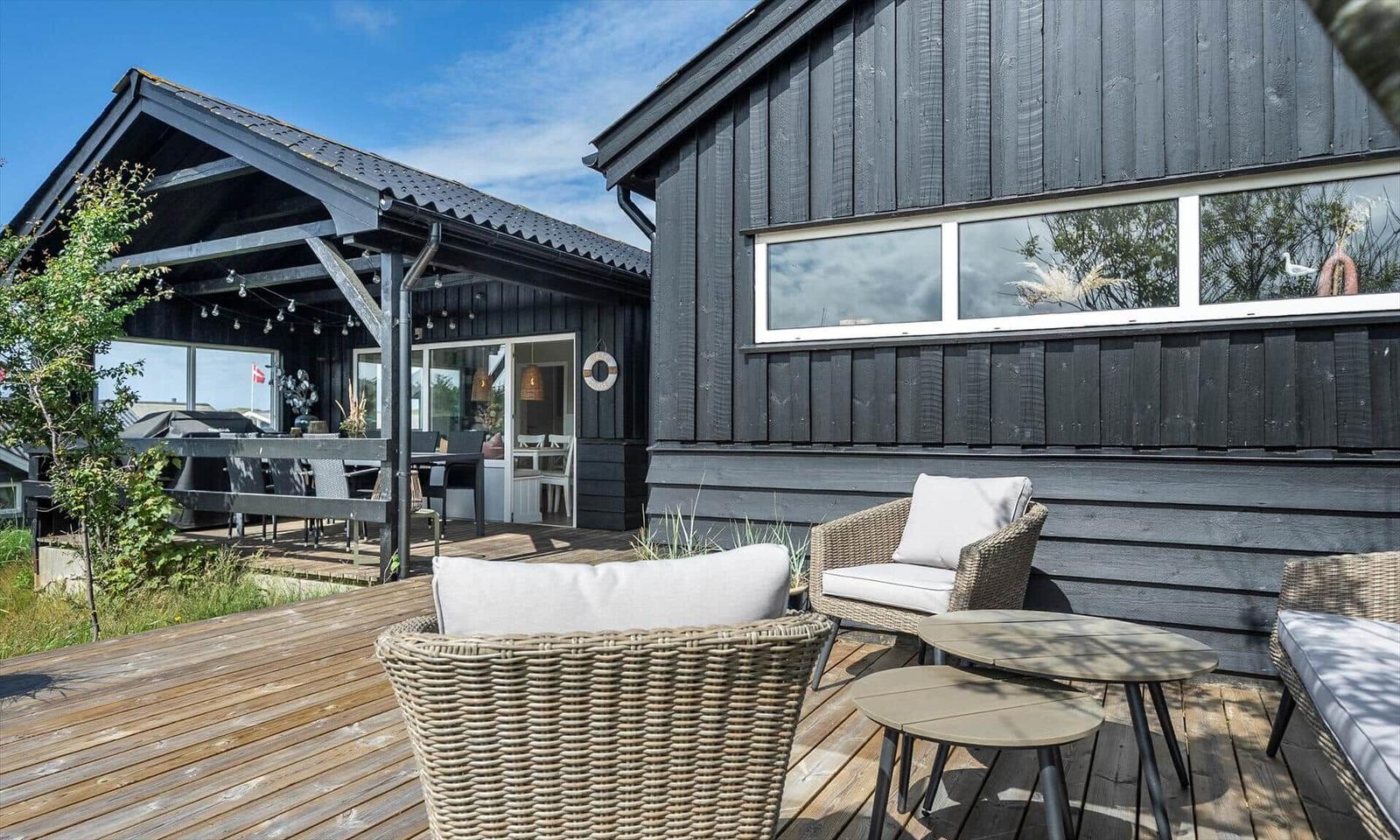 Deck with seating and view of the house.