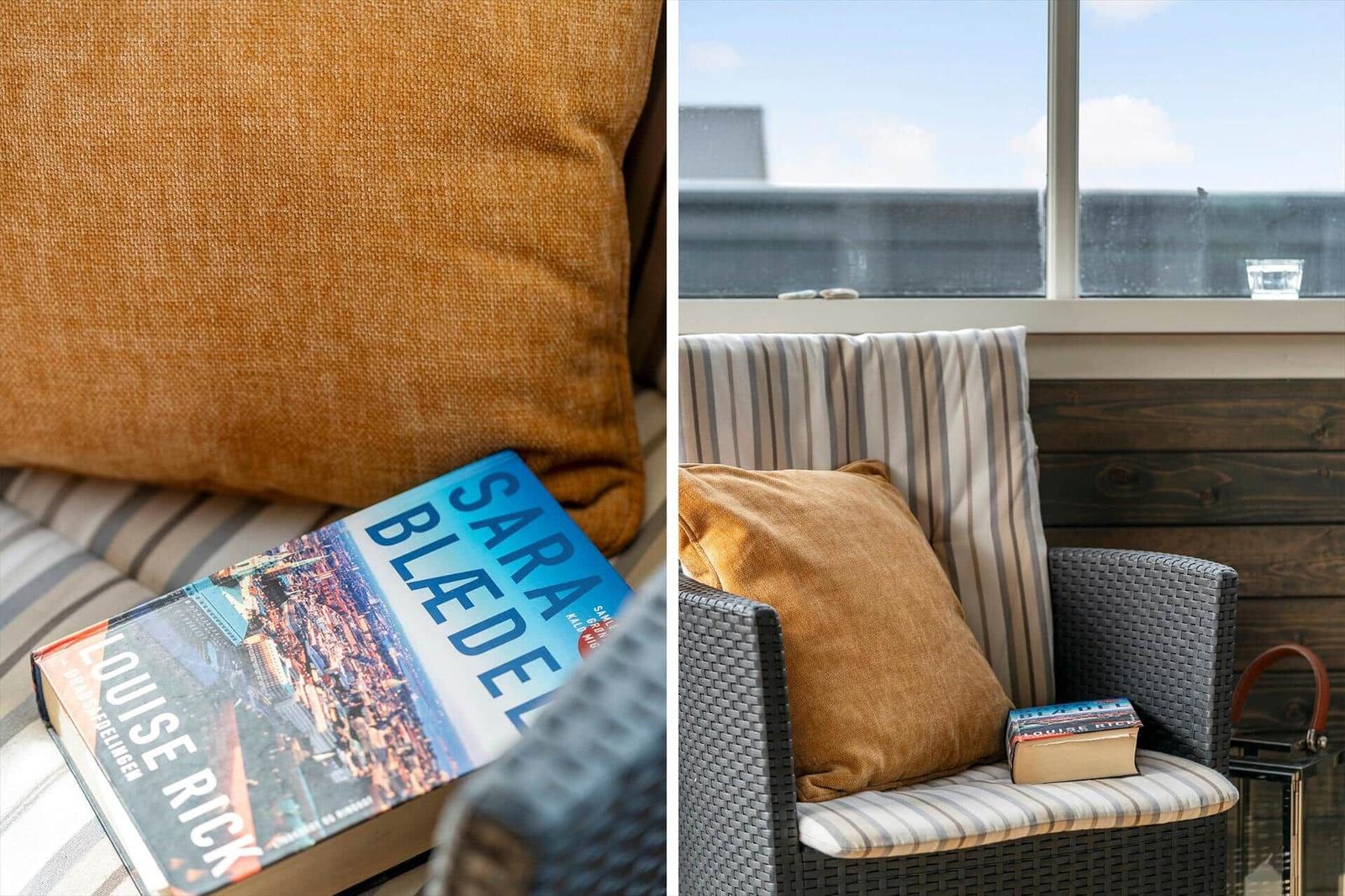Sitzgelegenheit mit Kissen und Buch vor großem Fenster