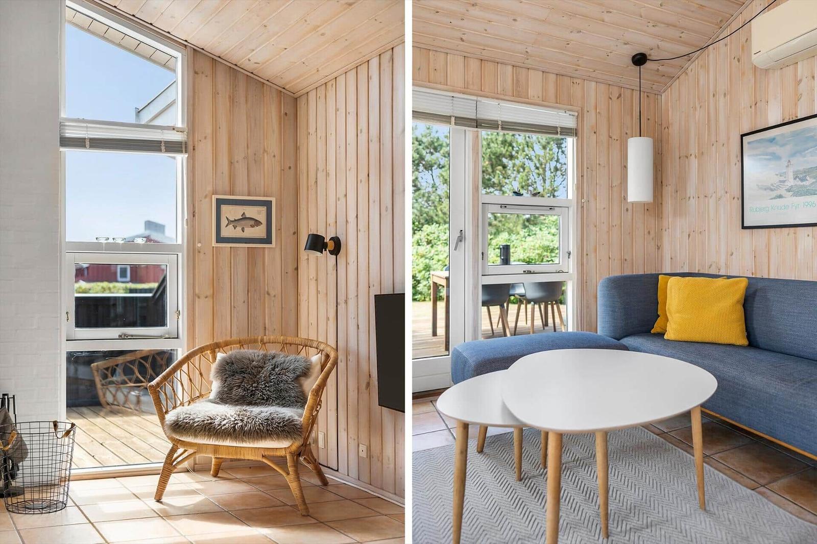 Living area with sofa, table, and window. Adjacent room with chair and window.
