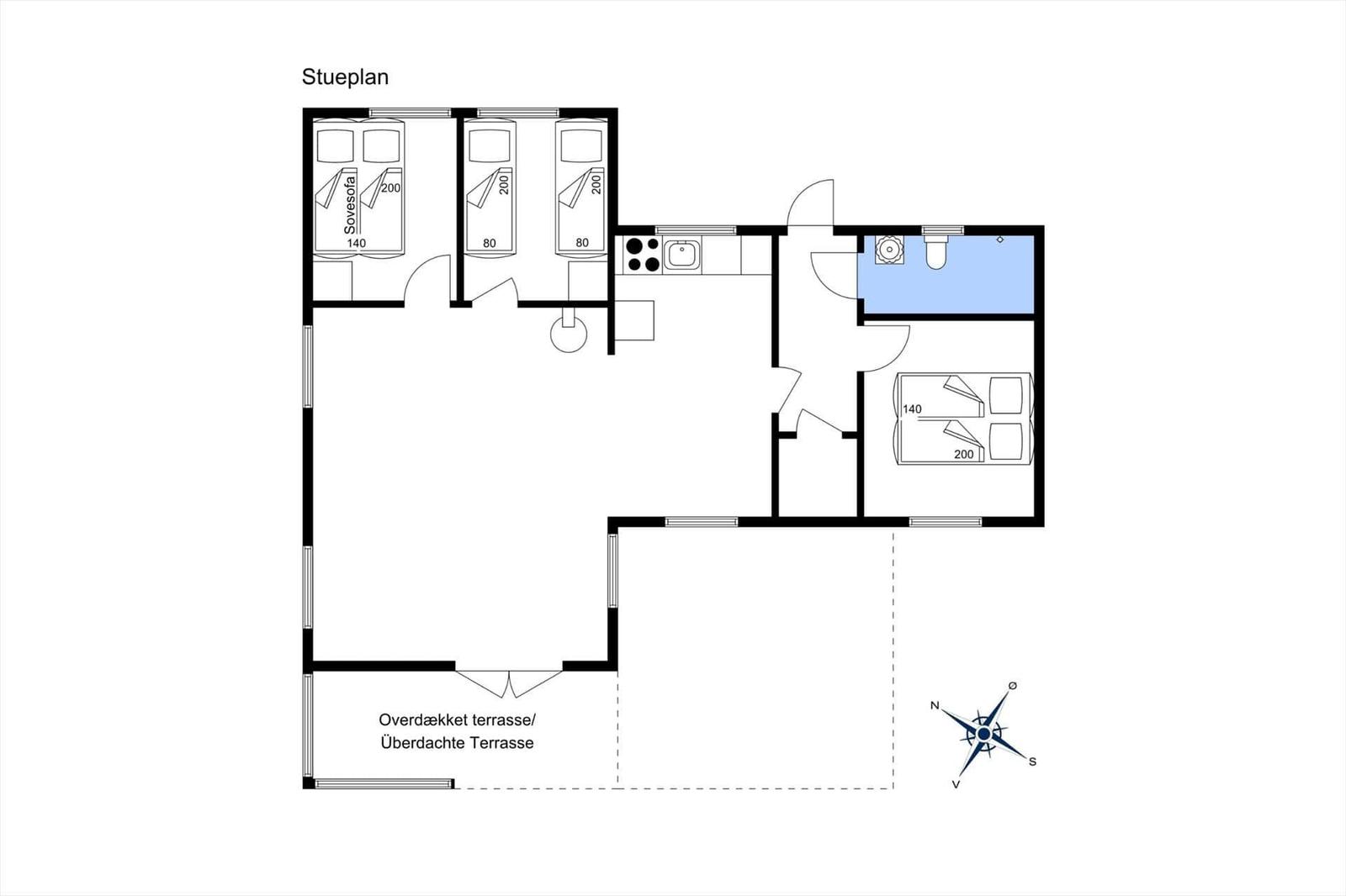 Two single beds in a wooden house room with window and wall pictures.