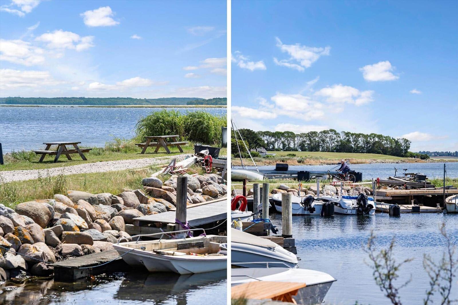 Boat harbor with piers and picnic tables by the water