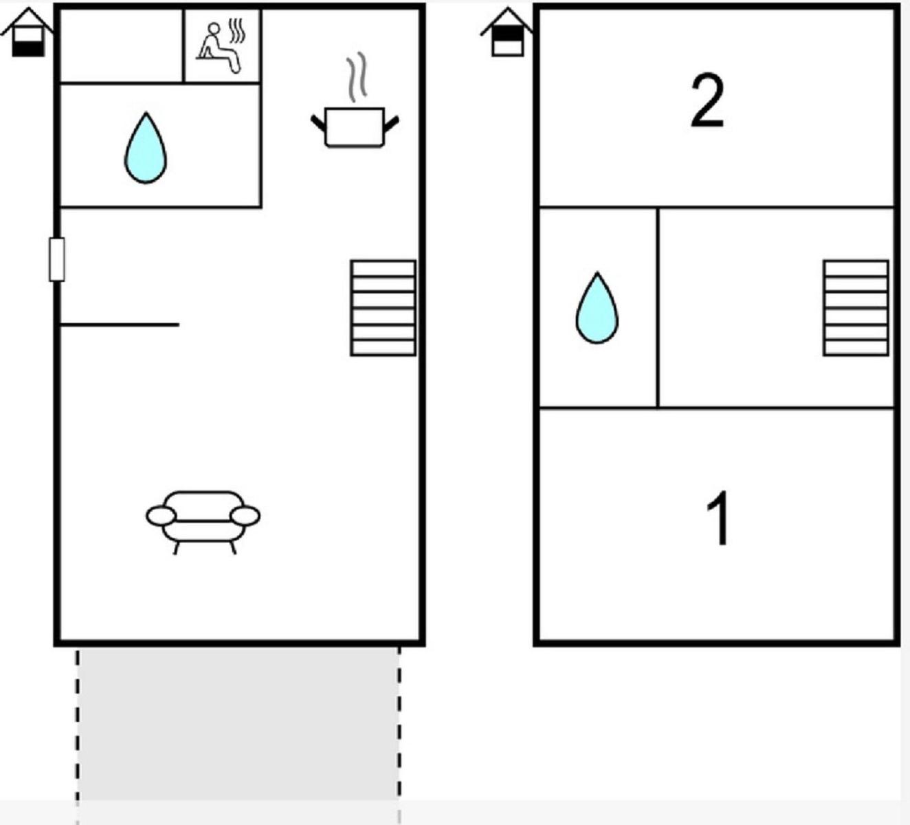 Weitläufige Siedlung mit weißen Häusern und grünen Rasenflächen am Wasser.