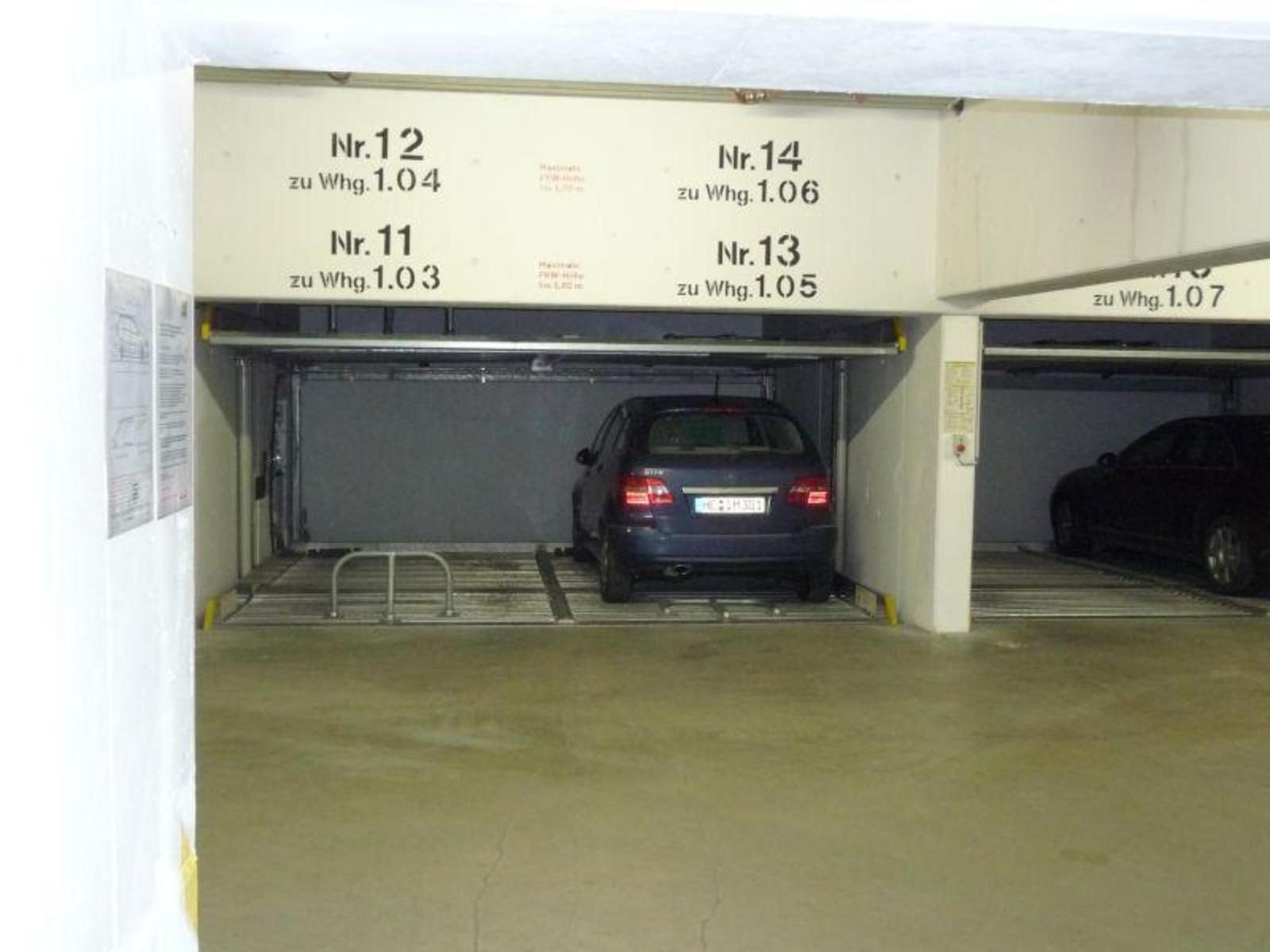 Underground parking with multiple spaces and marked numbers.
