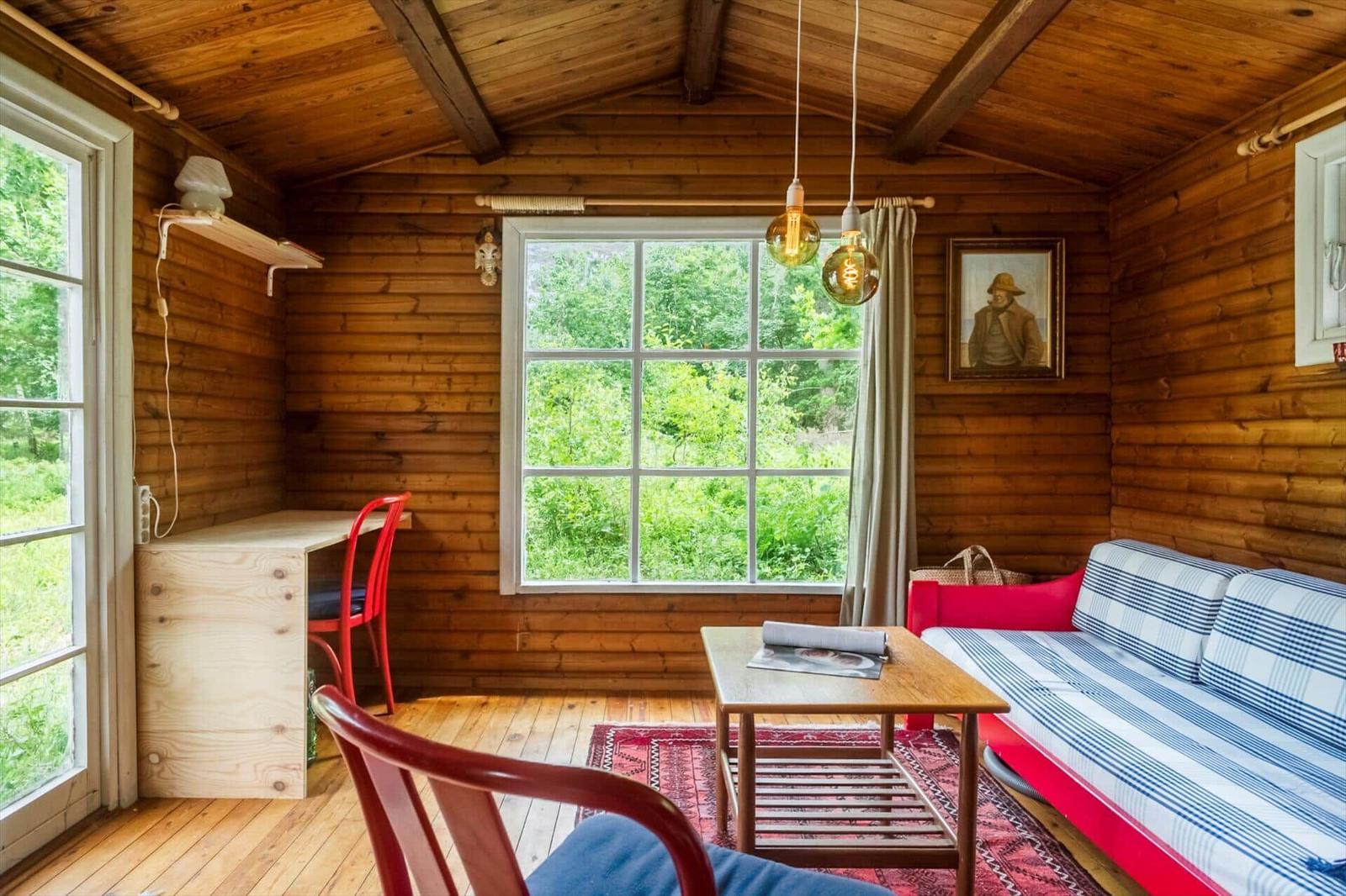 Apartment with kitchen, bathroom, and three bedrooms with beds.