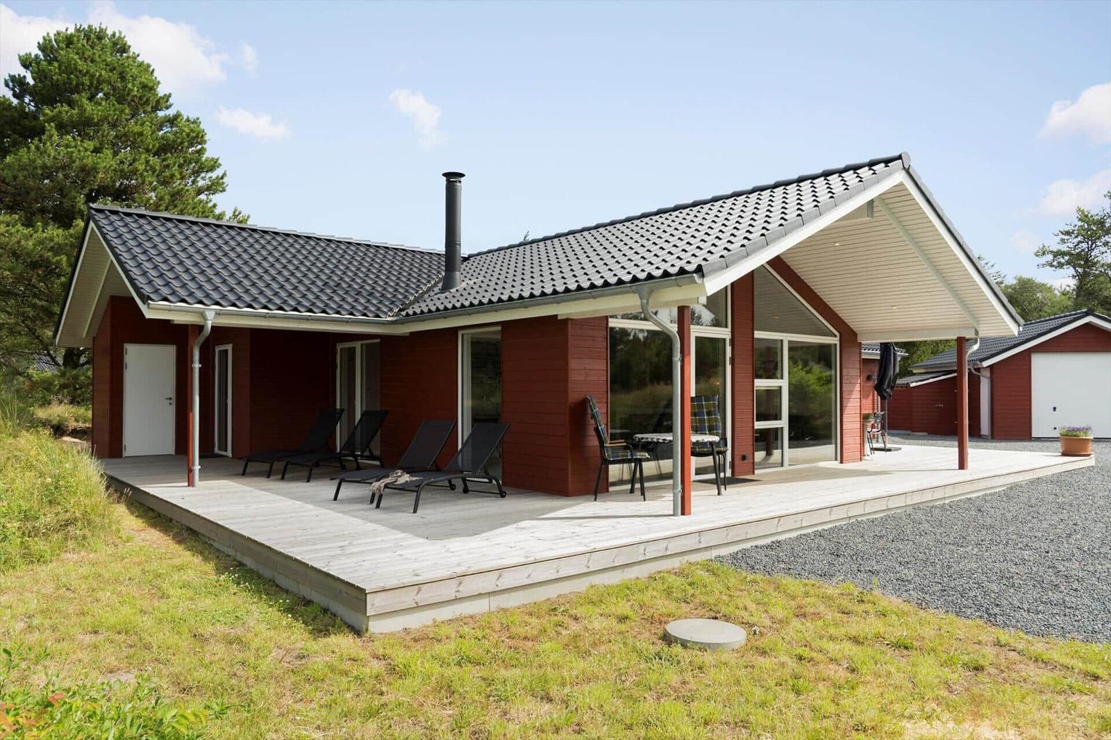 Modern wooden house with terrace, garden, and garage. Ideal for relaxation in the green.