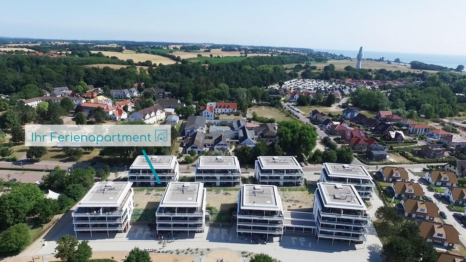 Wohnung mit Küche, Schlafzimmer, Bad und Terrasse.