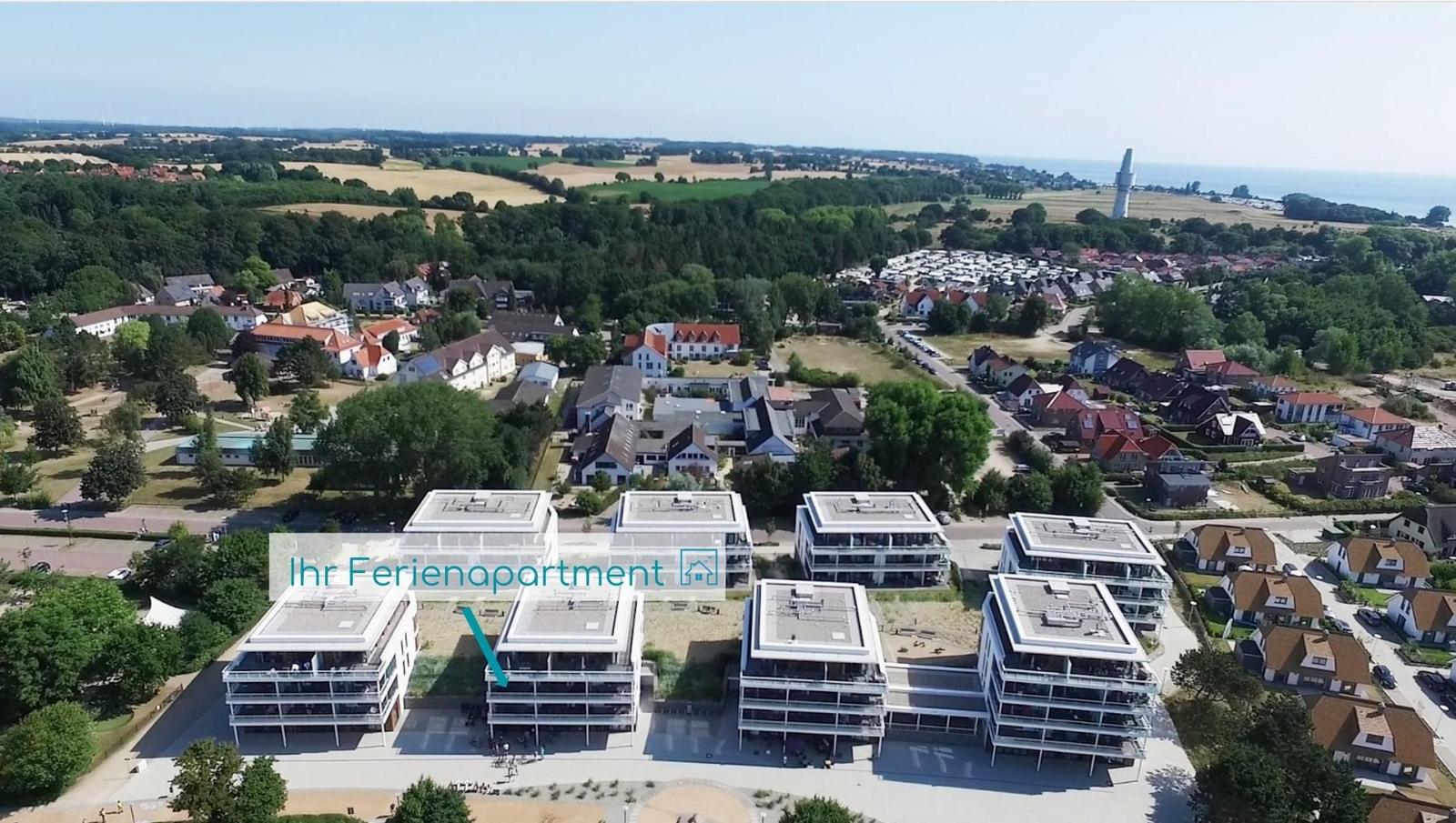 Wohnung mit drei Schlafzimmern, Küche, Wohnbereich und Balkon.