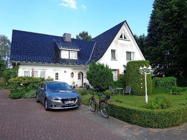 This apartment has a bedroom, kitchen, bathroom, and terrace with umbrella.