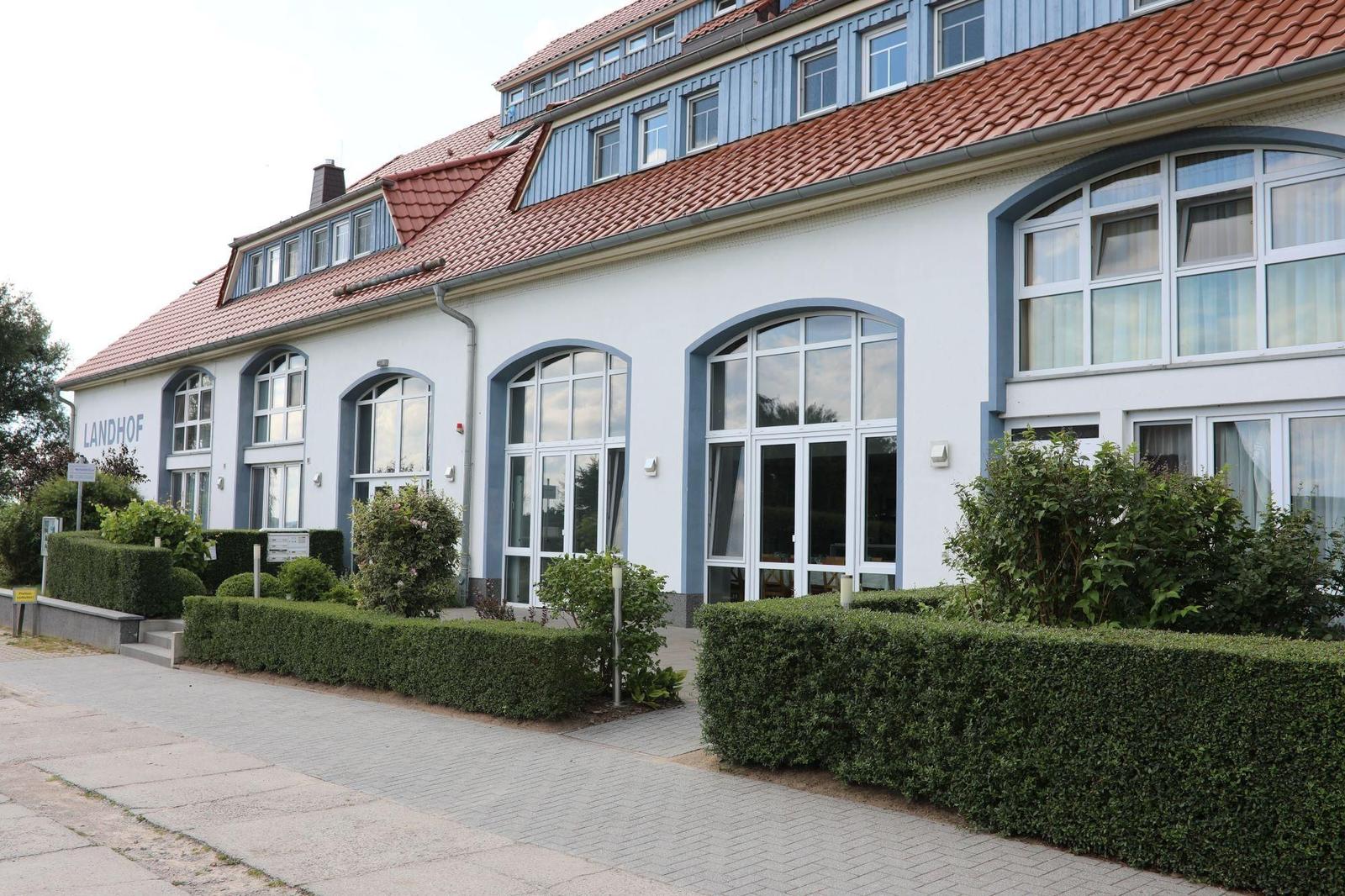 Funktionaler Grundriss mit drei Schlafzimmern, Küche und Wohnbereich.