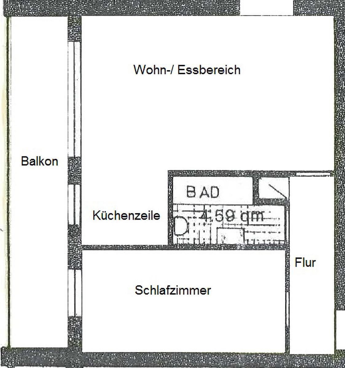 Ein dreistöckiges Gebäude mit Balkonen und rotem Backsteinfassade.