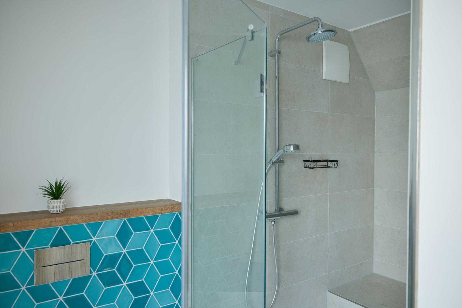 Aerial view of holiday homes near beach and water.
